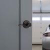 Kwikset Tustin Entry Door Handle with Lock and Key, Secure Keyed Reversible Lever Exterior, For Front Entrance and Bedrooms, Venetian Bronze, Pick Resistant Smartkey Rekey Security and Microban