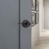 Kwikset Tustin Entry Door Handle with Lock and Key, Secure Keyed Reversible Lever Exterior, For Front Entrance and Bedrooms, Venetian Bronze, Pick Resistant Smartkey Rekey Security and Microban