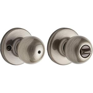 Kwikset Polo Bed/Bath Knob in Antique Brass