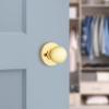 Kwikset Polo Dummy Door Knob, Single Sided Handle for Closets, French Double Doors, and Pantry, Polished Brass Non-Turning Interior Push/Pull Door Knob